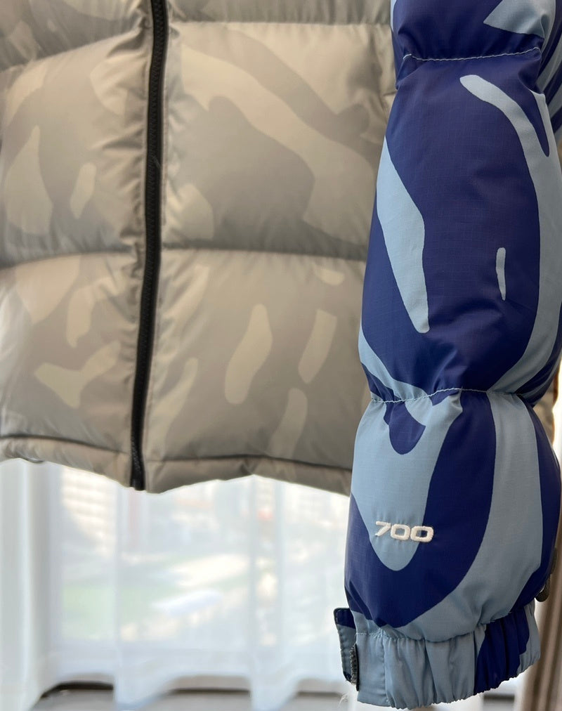 KAWS x The North Face Nuptse Down Jacket "Moonlight Ivory"