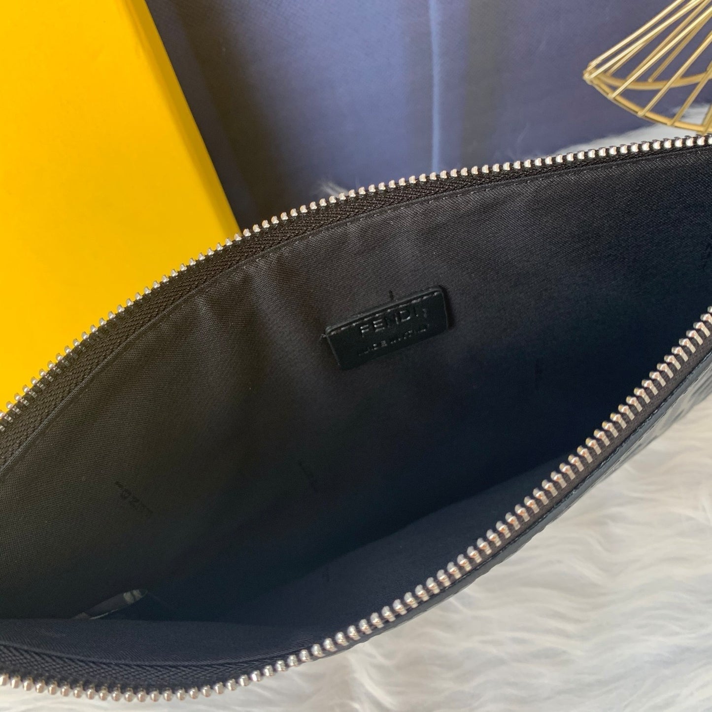 Fendi FF Embossed Leather Clutch Bag