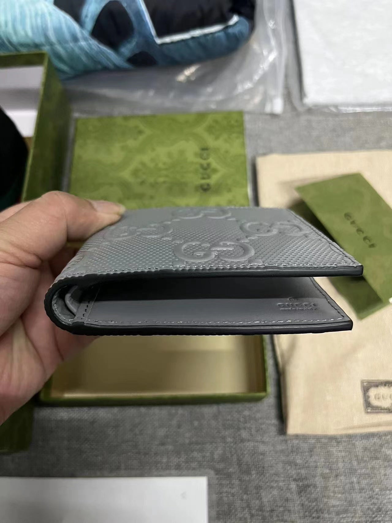 Gucci Textured Leather GG Embossed Bifold Wallet