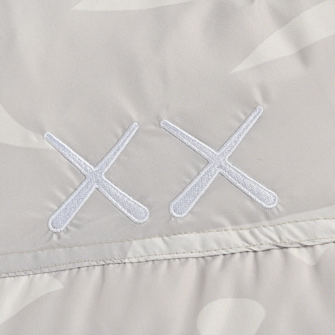 KAWS x The North Face Nuptse 1996 Down Jacket "Moonlight Ivory"