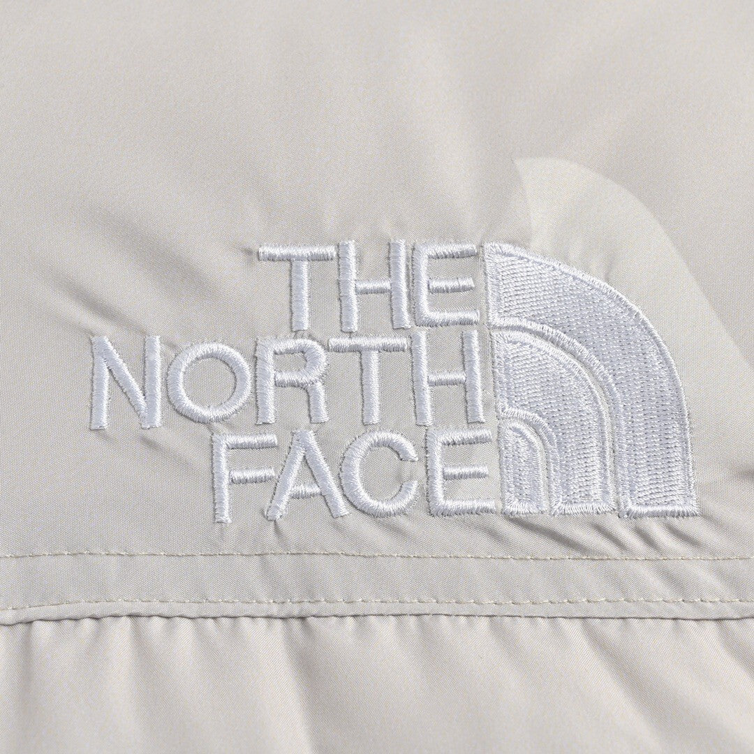 KAWS x The North Face Nuptse 1996 Down Jacket "Moonlight Ivory"