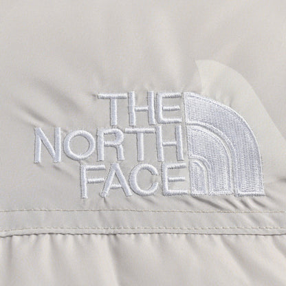 KAWS x The North Face Nuptse 1996 Down Jacket "Moonlight Ivory"