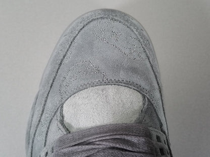 Kaws x Air Jordan 4 Retro "Cool Grey"