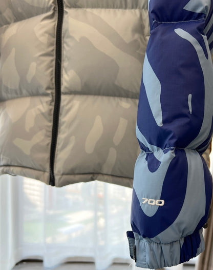 KAWS x The North Face Nuptse Down Jacket "Moonlight Ivory"