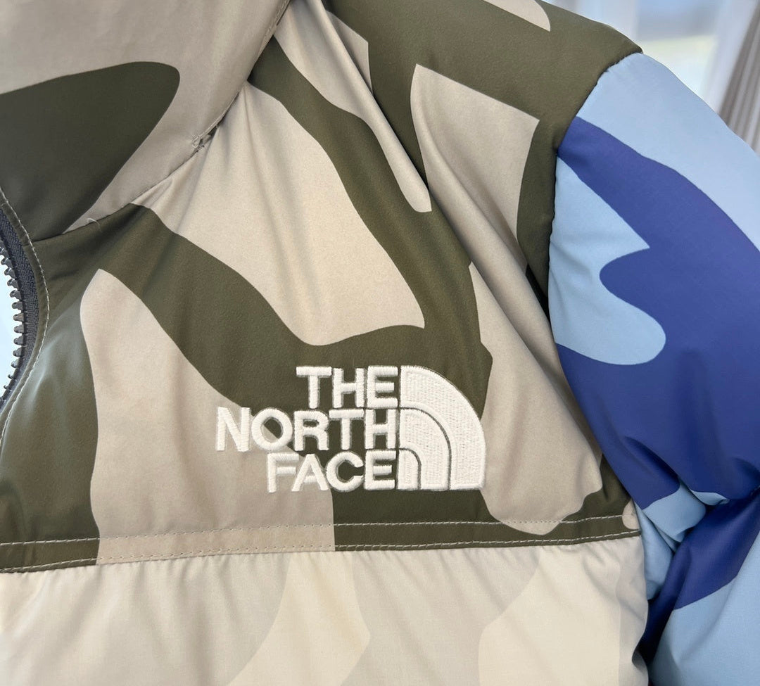 KAWS x The North Face Nuptse Down Jacket "Moonlight Ivory"