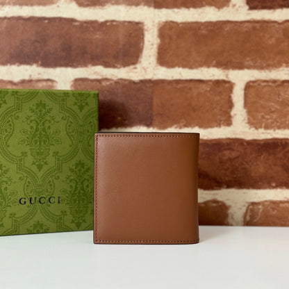 Gucci GG Emblem Bi-Fold Embossed Leather Wallet